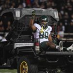 
              Baylor tight end Drake Dabney (89) raises his hand as he is driven off the field after an injury during the first half of an NCAA college football game against Texas Tech, Saturday, Oct. 29, 2022, in Lubbock, Texas. (AP Photo/Justin Rex)
            