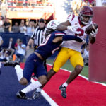 Southern California wide receiver Brenden Rice (2) catches a touchdown over Arizona cornerback Treydan Stukes (20) in the first half during an NCAA college football game, Saturday, Oct. 29, 2022, in Tucson, Ariz. (AP Photo/Rick Scuteri)