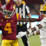 Southern California wide receiver Mario Williams, left, stiff arms Arizona State defensive back Jordan Clark during the first half of an NCAA college football game Saturday, Oct. 1, 2022, in Los Angeles. (AP Photo/Mark J. Terrill)
