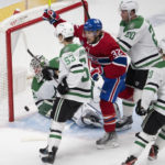 
              Montreal Canadiens' Rem Pitlick (32) celebrates after a goal as Dallas Stars goaltender Jake Oettinger (29), Wyatt Johnston (53), Ryan Suter (20) and Ty Dellandrea (10) look on during first-period NHL hockey game action Saturday, Oct. 22, 2022, in Montreal. (Ryan Remiorz/The Canadian Press via AP)
            