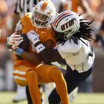 
              Tennessee wide receiver Jalin Hyatt (11) is tackled by Tennessee Martin safety Oshae Baker (9) during the first half of an NCAA college football game Saturday, Oct. 22, 2022, in Knoxville, Tenn. (AP Photo/Wade Payne)
            