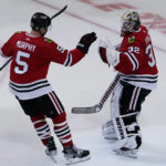
              Chicago Blackhawks defenseman Connor Murphy, left, celebrates with goaltender Alex Stalock after they defeated the Seattle Kraken in an NHL hockey game in Chicago, Sunday, Oct. 23, 2022. (AP Photo/Nam Y. Huh)
            