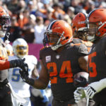 
              Cleveland Browns running back Nick Chubb (24) celebrates with tight end David Njoku (85) and guard Joel Bitonio (75) after scoring a touchdown against the Los Angeles Chargers during the first half of an NFL football game, Sunday, Oct. 9, 2022, in Cleveland. (AP Photo/Ron Schwane)
            