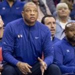 
              Philadelphia 76ers head coach Doc Rivers watches from the bench in the first half of an NBA basketball game against the San Antonio Spurs, Saturday, Oct. 22, 2022, in Philadelphia. (AP Photo/Laurence Kesterson)
            