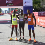 Chicago Marathon third place finisher John Korir, of Kenya, left, winner Benson Kipruto, center, also from Kenya, and Seifu Tura Abdiwak, from Ethiopia, who took second, pose after the race, Sunday, Oct. 9, 2022, in Chicago. (AP Photo/Matt Marton)