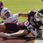 Mississippi State wide receiver Austin Williams (85) rolls in the end zone with a 10-yard touchdown reception against Arkansas during the first half of an NCAA college football game in Starkville, Miss., Saturday, Oct. 8, 2022. (AP Photo/Rogelio V. Solis)