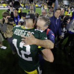 
              Green Bay Packers quarterback Aaron Rodgers (12) talks with New England Patriots head coach Bill Belichick after an NFL football game, Sunday, Oct. 2, 2022, in Green Bay, Wis. The Packers won 27-24 in overtime. (AP Photo/Mike Roemer)
            
