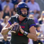 
              TCU quarterback Max Duggan (15) looks to pass during the first half of an NCAA college football game against Oklahoma State in Fort Worth, Texas, Saturday, Oct. 15, 2022. (AP Photo/Sam Hodde)
            
