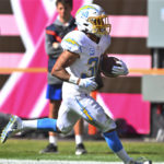 
              Los Angeles Chargers running back Austin Ekeler (30) runs in for a touchdown against the Cleveland Browns during the first half of an NFL football game, Sunday, Oct. 9, 2022, in Cleveland. (AP Photo/David Richard)
            