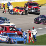 
              Bubba Wallace, center right, shoves Kyle Larson (5) after they crashed during a NASCAR Cup Series auto race at Las Vegas Motor Speedway in Las Vegas, Sunday, Oct. 16, 2022. (Steve Marcus/Las Vegas Sun via AP)
            