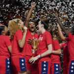 
              The United States hold their trophy as they celebrate on the podium after defeating China in the gold medal game at the women's Basketball World Cup in Sydney, Australia, Saturday, Oct. 1, 2022. (AP Photo/Mark Baker)
            
