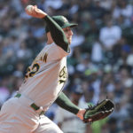 
              Oakland Athletics starting pitcher James Kaprielian throws against the Seattle Mariners during the first inning of a baseball game, Sunday, Oct. 2, 2022, in Seattle. (AP Photo/Jason Redmond)
            