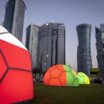FILE - Domes featuring different national colors are displayed near the Doha Exhibition and Convention Center where soccer World Cup draw will be held, in Doha, Qatar, Thursday, March 31, 2022. Qatar's residents squeezed as World Cup rental demand soars. (AP Photo/Darko Bandic, File)