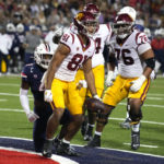 Southern California wide receiver Kyle Ford (81) reacts after scoring a touchdown against Arizona in the second half during an NCAA college football game, Saturday, Oct. 29, 2022, in Tucson, Ariz. (AP Photo/Rick Scuteri)