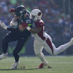 Seattle Seahawks tight end Will Dissly (89) runs against Arizona Cardinals linebacker Zaven Collins (25) during the first half of an NFL football game in Seattle, Sunday, Oct. 16, 2022. (AP Photo/Abbie Parr)