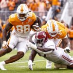 Tennessee tight end Princeton Fant (88) gets past Alabama defensive lineman Byron Young (47) en route to a touchdown during the first half of an NCAA college football game Saturday, Oct. 15, 2022, in Knoxville, Tenn. (AP Photo/Wade Payne)