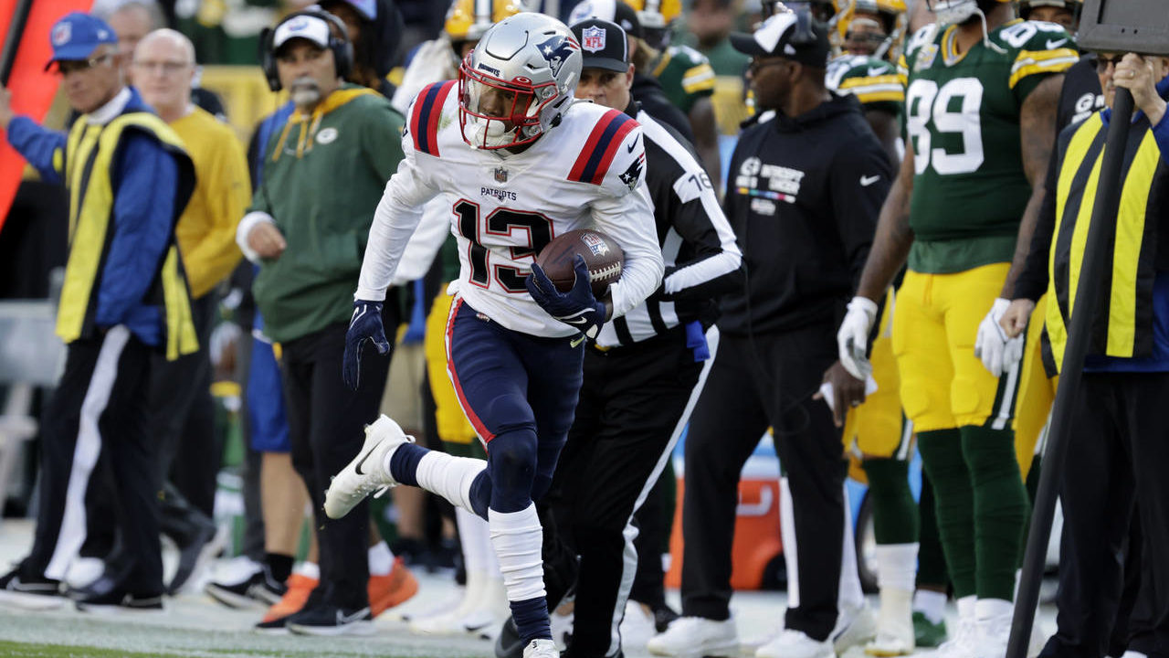 New England Patriots cornerback Jack Jones (13) returns an interception 40-yards for a touchdown du...