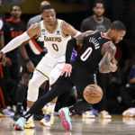 
              Portland Trail Blazers guard Damian Lillard, right, loses the ball with Los Angeles Lakers guard Russell Westbrook defending during the first half of an NBA basketball game Sunday, Oct. 23, 2022, in Los Angeles. (AP Photo/Alex Gallardo)
            