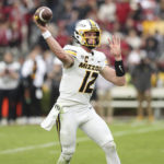 
              Missouri quarterback Brady Cook (12) throws a pass during the first half of an NCAA college football game against South Carolina, Saturday, Oct. 29, 2022, in Columbia, S.C. (AP Photo/Artie Walker Jr.)
            