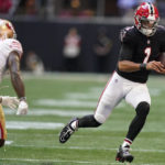 
              Atlanta Falcons quarterback Marcus Mariota (1) runs against the San Francisco 49ers during the second half of an NFL football game, Sunday, Oct. 16, 2022, in Atlanta. (AP Photo/Brynn Anderson)
            