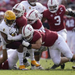 Arizona State running back Xazavian Valladay (1) is tackled by Stanford defenders during the first half of an NCAA college football game in Stanford, Calif., Saturday, Oct. 22, 2022. (AP Photo/Jeff Chiu)