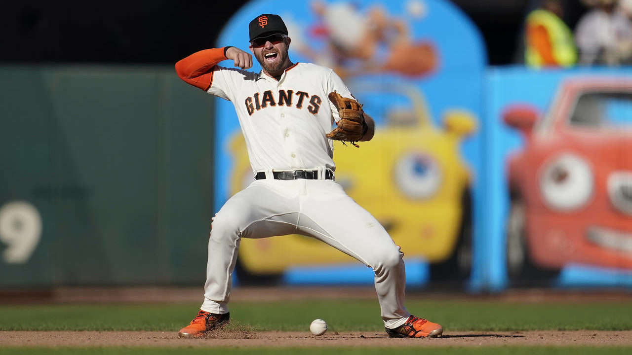 San Francisco Giants third baseman Evan Longoria reacts after not being to field a base hit by Ariz...
