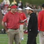 Georgia coach Kirby Smart, left, and Missouri coach Eliah Drinkwitz talk before an NCAA college football game Saturday, Oct. 1, 2022, in Columbia, Mo. (AP Photo/L.G. Patterson)
