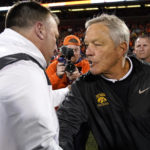 
              Iowa head coach Kirk Ferentz, right, congratulates Illinois head coach Bret Bielema after Illinois 9-6 win over Iowa after an NCAA college football game Saturday, Oct. 8, 2022, in Champaign, Ill. (AP Photo/Charles Rex Arbogast)
            