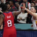 China's Wu Tongtong reacts with United States' Chelsea Gray following their gold medal game at the women's Basketball World Cup in Sydney, Australia, Saturday, Oct. 1, 2022. (AP Photo/Mark Baker)