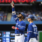 Toronto Blue Jays left fielder Raimel Tapia (15) celebrates after hitting a single during the second inning of a baseball game against the Boston Red Sox in Toronto on Saturday, Oct. 1, 2022. (Christopher Katsarov/The Canadian Press via AP)