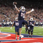 
              Arizona tight end Tanner McLachlan (84) celebrates after scoring a touchdown against Colorado in the first half during an NCAA college football game, Saturday, Oct. 1, 2022, in Tucson, Ariz. (AP Photo/Rick Scuteri)
            