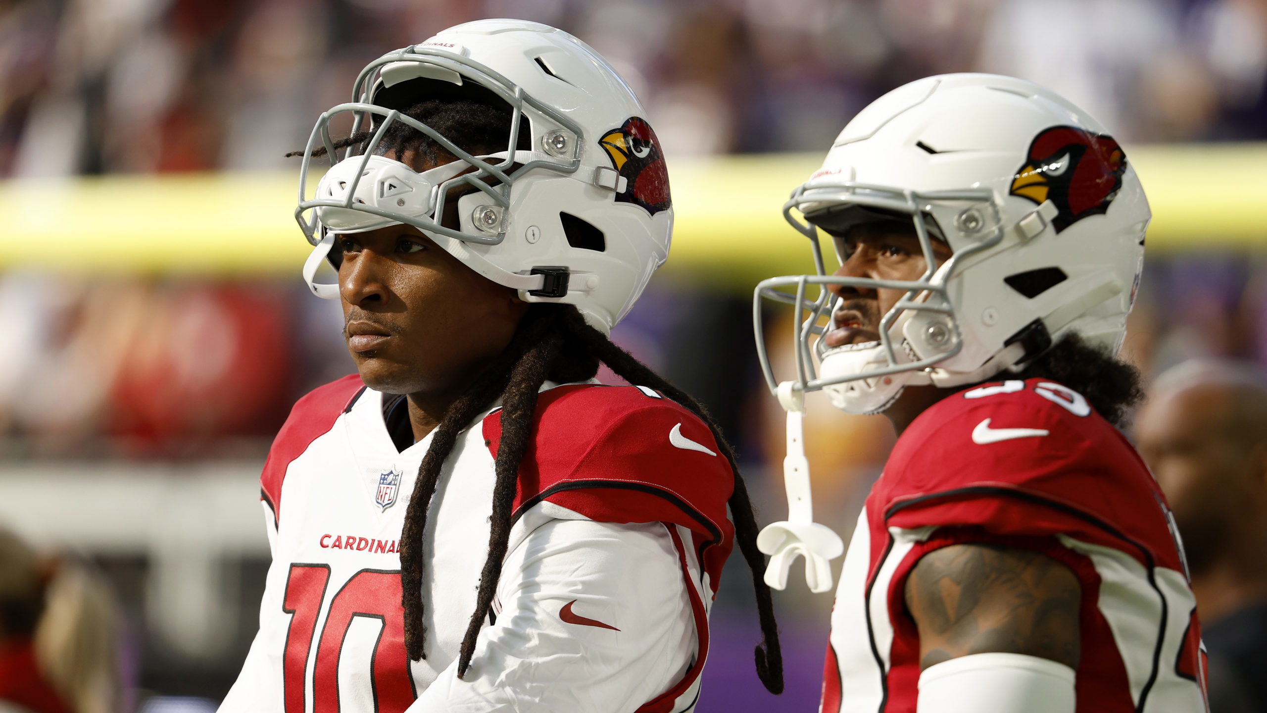 DeAndre Hopkins #10 of the Arizona Cardinals and Antonio Hamilton #33 react before a game against t...