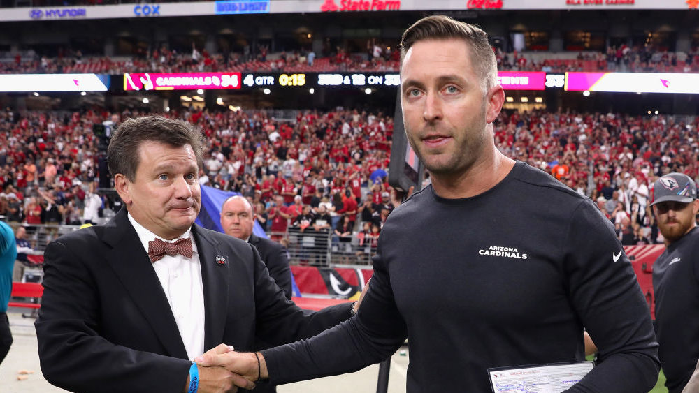 Head coach Kliff Kingsbury of the Arizona Cardinals shakes hands with owner/president Michael Bidwi...
