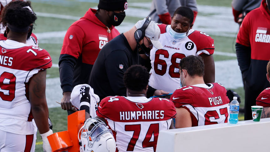 Arizona Cardinals offensive line coach Sean Kugler talks to his players during a game between the N...