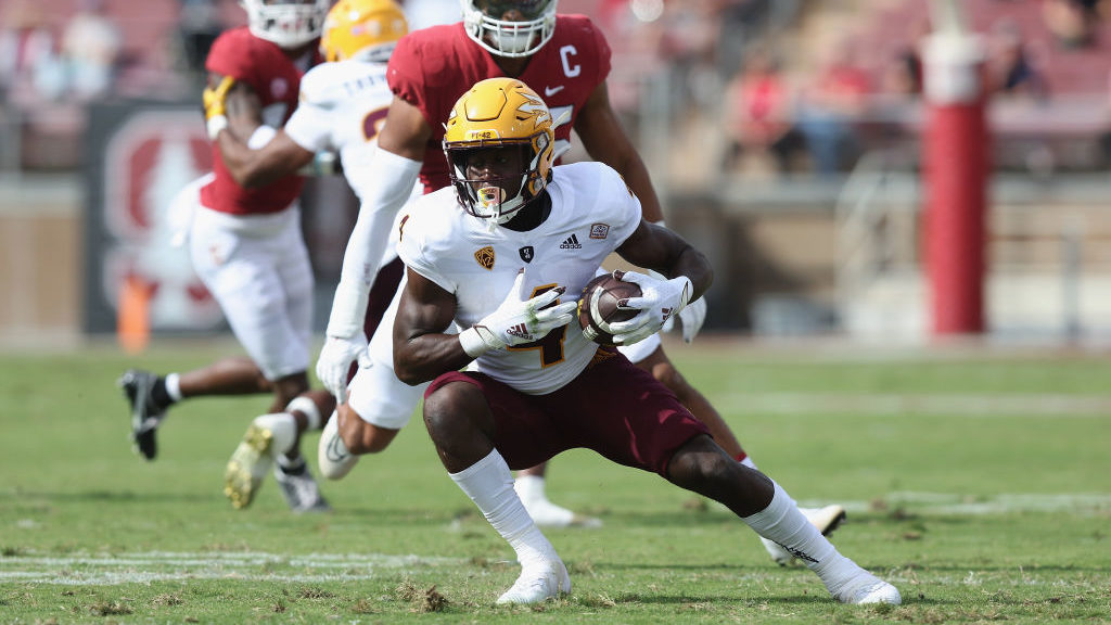 Running back Daniyel Ngata #4 of the Arizona State Sun Devils runs the ball against a Stanford Card...