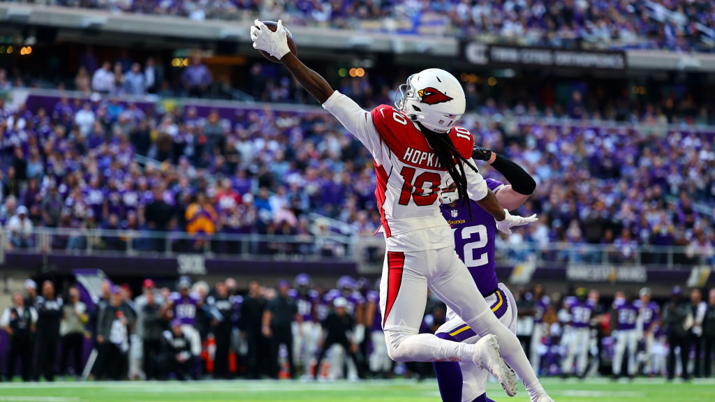 DeAndre Hopkins #10 of the Arizona Cardinals catches the ball for a touchdown as Harrison Smith #22...