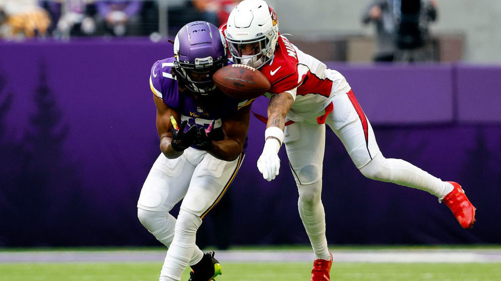 Byron Murphy Jr. #7 of the Arizona Cardinals breaks up a pass intended for K.J. Osborn #17 of the M...