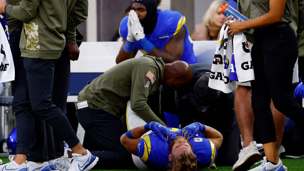 Cooper Kupp #10 of the Los Angeles Rams lays on the ground with an injury during the fourth quarter...