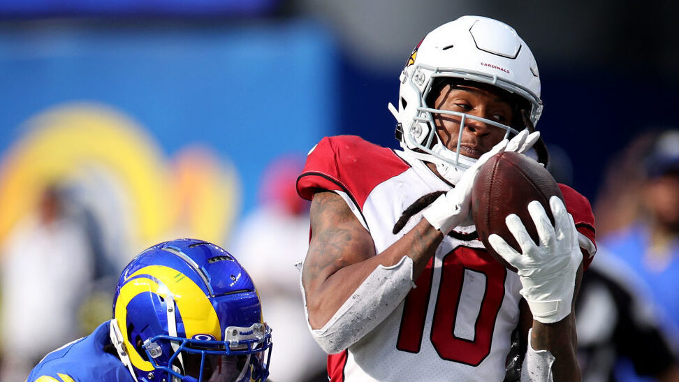 DeAndre Hopkins #10 of the Arizona Cardinals makes a catch in front of David Long Jr. #22 of the Lo...