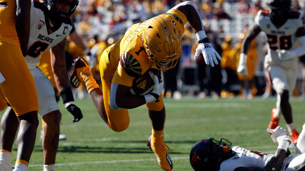 Running back Xazavian Valladay #1 of the Arizona State Sun Devils is tackled during the first half ...