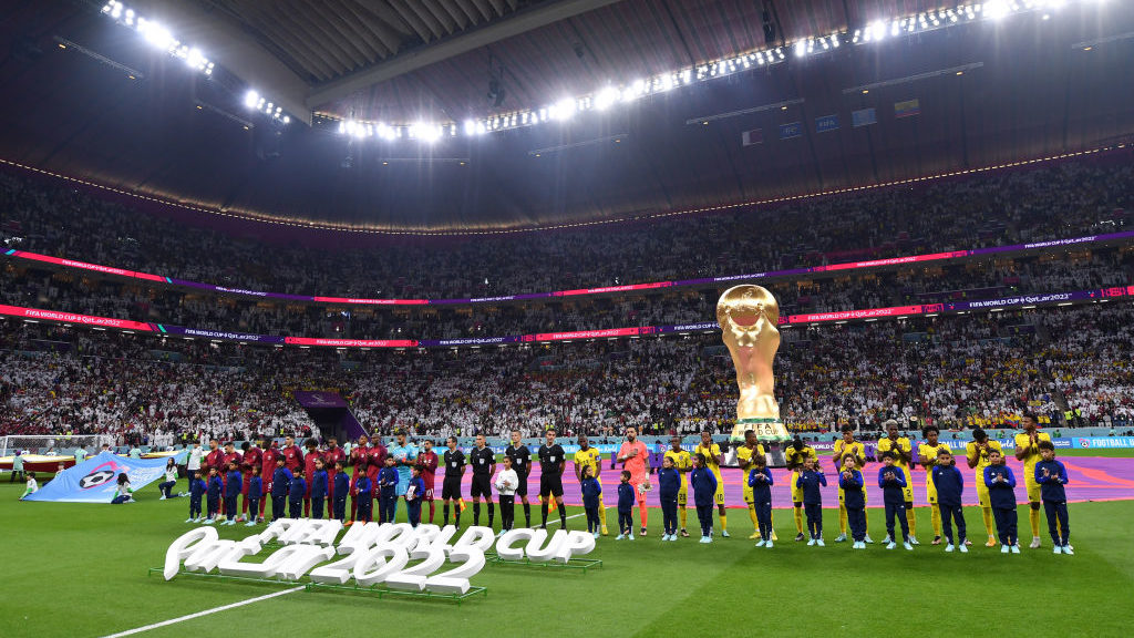 Players and match officials line up prior to the FIFA World Cup Qatar 2022 Group A match between Qa...