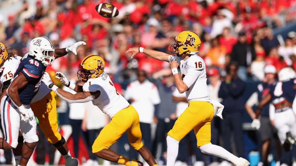 Quarterback Trenton Bourguet #16 of the Arizona State Sun Devils throws a pass during the first hal...
