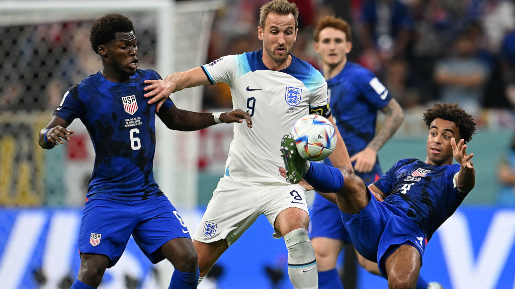 Tyler Adams of United States controls the ball under pressure of Harry Kane of England during the F...