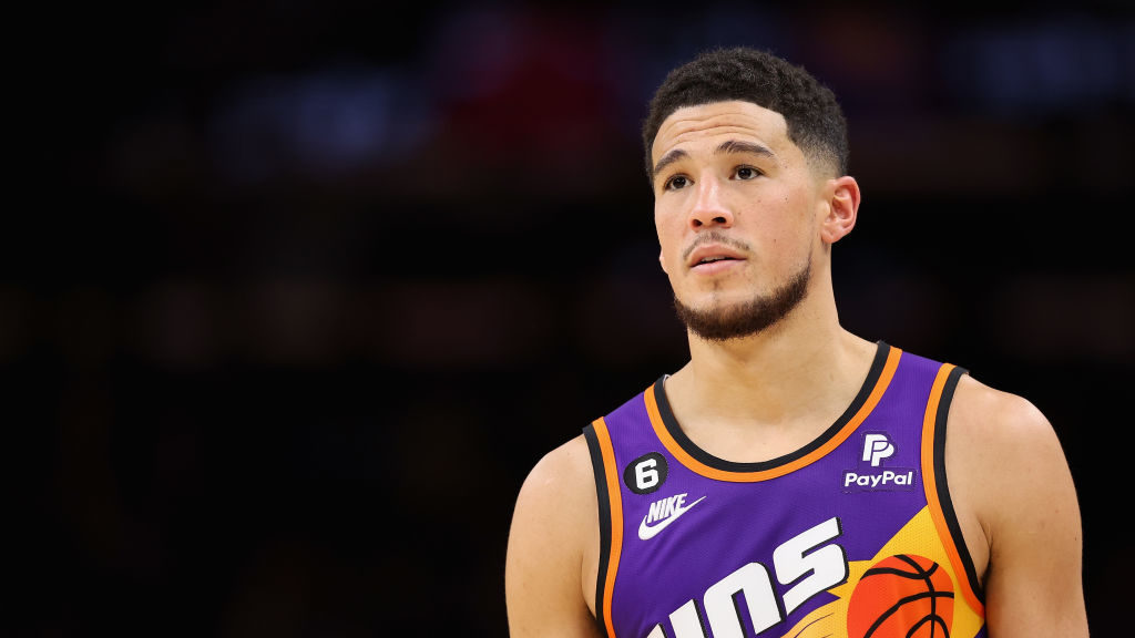 Devin Booker #1 of the Phoenix Suns reacts during the second half of the NBA game against the Chica...