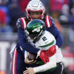 New England Patriots safety Kyle Dugger, top, sacks New York Jets quarterback Zach Wilson (2) during the second half of an NFL football game, Sunday, Nov. 20, 2022, in Foxborough, Mass. (AP Photo/Steven Senne)