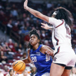 
              Hampton forward Nylah Young, left, drives to the basket against South Carolina center Kamilla Cardoso during the first quarter of an NCAA college basketball game in Columbia, S.C., Sunday, Nov. 27, 2022. (AP Photo/Nell Redmond)
            
