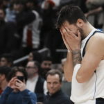 Dallas Mavericks' Luka Doncic reacts after a turnover in possession with seconds left on the clock during his team's loss to the Toronto Raptors in NBA basketball game action in Toronto, Saturday, Nov. 26, 2022. (Chris Young/The Canadian Press via AP)