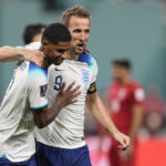 England's Marcus Rashford, left, is congratulated by his teammate Harry Kane after scoring his side's fifth goal against Iran during the World Cup group B soccer match between England and Iran at the Khalifa International Stadium, in Doha, Qatar, Monday, Nov. 21, 2022. (AP Photo/Martin Meissner)
