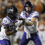 TCU quarterback Max Duggan (15) hands off to running back Kendre Miller (33) during the first half of the team's NCAA college football game against Texas on Saturday, Nov. 12, 2022, in Austin, Texas. (AP Photo/Stephen Spillman)