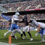 Detroit Lions running back D'Andre Swift (32) is brought down by Chicago Bears linebacker Nicholas Morrow (53) during the first half of an NFL football game in Chicago, Sunday, Nov. 13, 2022. (AP Photo/Nam Y. Huh)